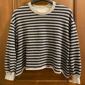 The GREAT. cropped sweatshirt. Rolled hem. Puff sleeves at cuff.